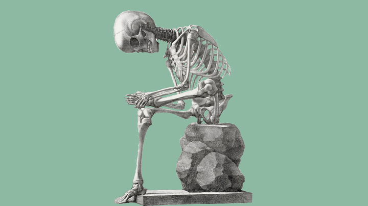 A vintage illustration of a human skeleton sat on a rock, its left ankle on its right knee in a stretching position